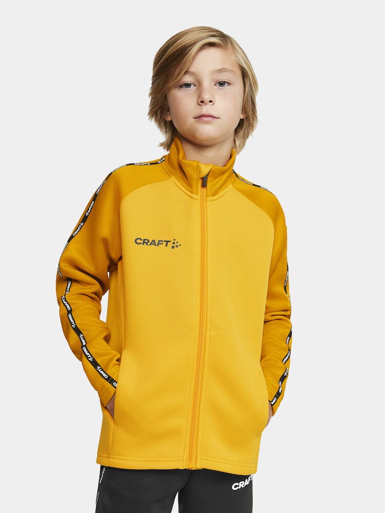 Craft - Squad 2.0 Full Zip Jr Sweden Yellow-Golden 134/140