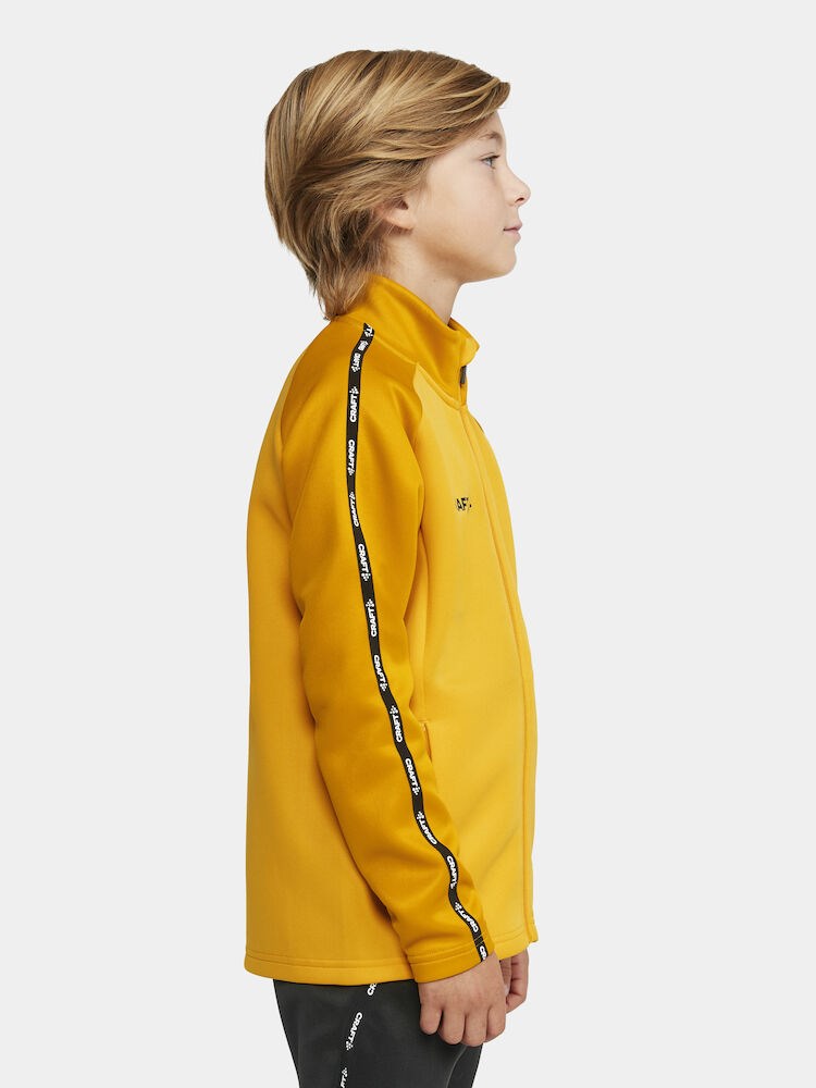 Craft - Squad 2.0 Full Zip Jr Sweden Yellow-Golden 134/140