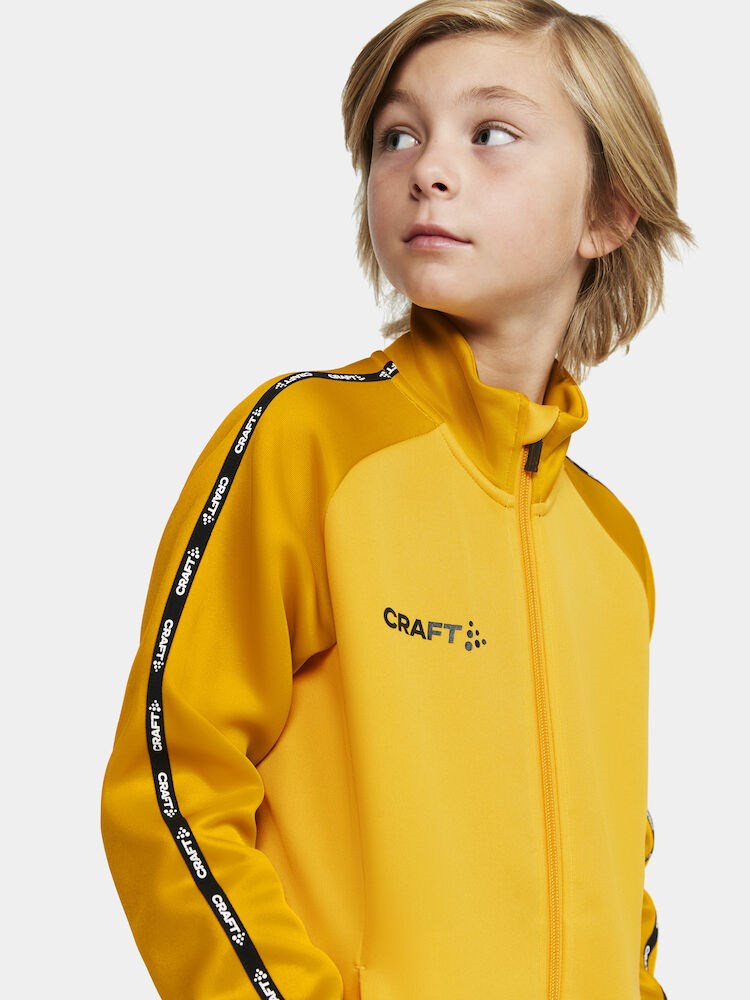 Craft - Squad 2.0 Full Zip Jr Sweden Yellow-Golden 134/140